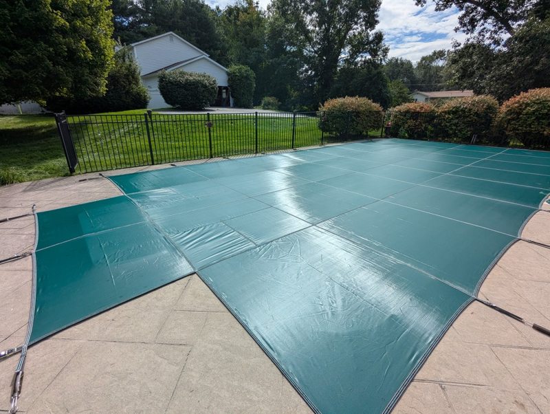The pool tucked away under its new cover